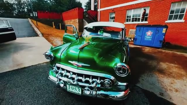 Green 1953 Chevrolet front end with chrome grille