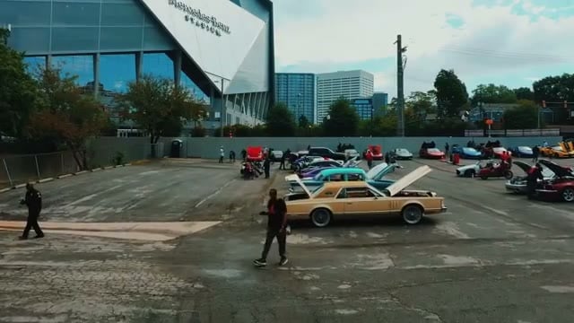 Wide view of show cars parked across the lot